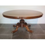 A good 19th century rosewood breakfast table with an oval 152cm x 120cm top on a carved quatrefoil