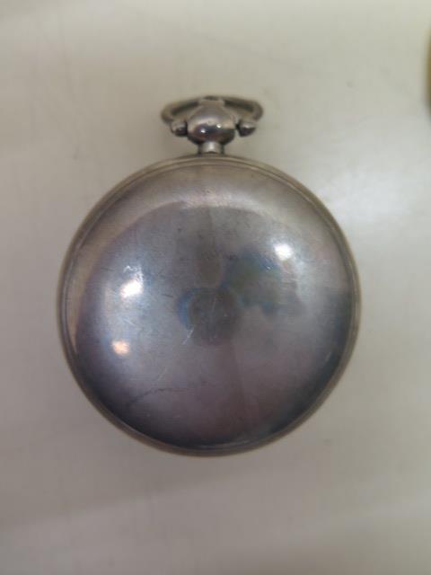 A silver cased pocket watch with a 5cm case, some wear to case and dial, running order, with key - Image 2 of 3