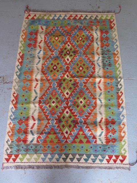 A hand knotted woollen Chobi Kilim, 155cm x 103cm