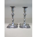 A pair of silver taper sticks with weighted bases, 12.5cm tall, Sheffield 1894/95, generally good