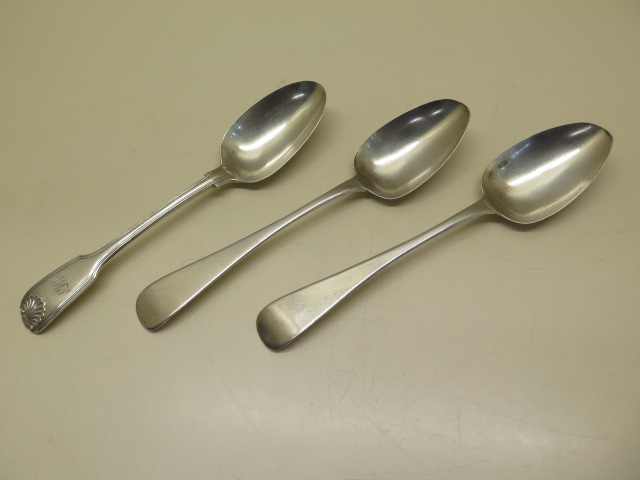 A pair of Irish silver table spoons, Dublin 1823, maker Joshua Buckton, 23cm long and another silver