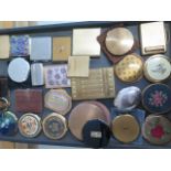 A collection of 26 compacts and a notepad