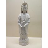 A 19th century Chinese porcelain figure of Guanyin in standing pose decorated with a blue/ white