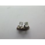 A pair of 14ct white gold oval cut diamond stud earrings each approx 5mm x 3.5mm x 2mm, in good