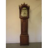 An oak and mahogany 8 day striking longcase clock with a 12" painted arched dial having secondary