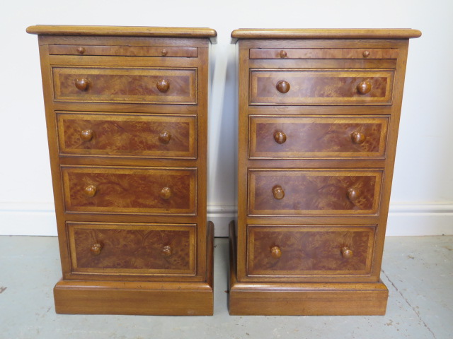 A pair of burr wood veneer four drawer bedside chests each with a slide, reveneered by made by a