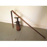 A vintage flail, total length 194cm, and a vintage wagon jack 51cm tall