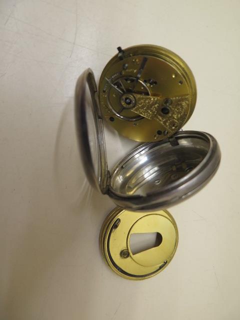 A silver cased pocket watch with a 5cm case, some wear to case and dial, running order, with key - Image 3 of 3