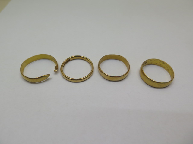 Three hallmarked 22ct band rings and a cut 22ct band ring, total weight approx 13 grams, sizes O/P/Q