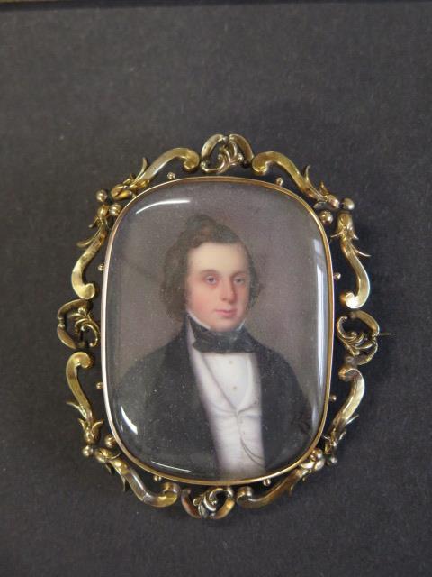 An early 19th century gold mounted miniature of a gentleman, very fine quality, memorial brooch-