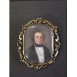 An early 19th century gold mounted miniature of a gentleman, very fine quality, memorial brooch-