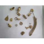 A hallmarked 9ct yellow gold bracelet and 15 9ct gold charms, total weight approx 33.2 grams