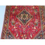 A hand knotted woollen Qashqai rug, 1.55m x 1.00m