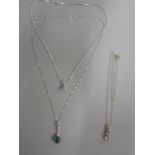 A 9ct pendant on chain (clasp cracked) and a 9ct white gold pendant on a chain and a 9ct pendant