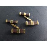 A pair of 18ct and mahogany cufflinks total weight approx 6 grams marked 750, in good condition