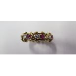 An 18ct yellow gold ruby and diamond full eternity ring with 8 x 0.13ct VVS1/G-H brilliant cut