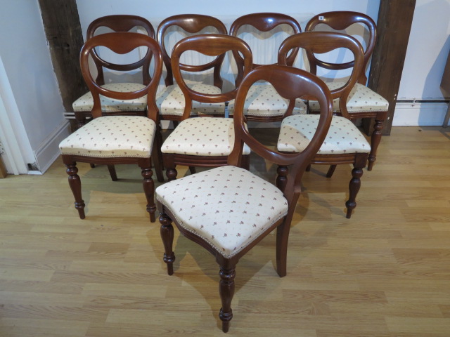 A matched set of eight (6 + 2) Victorian mahogany balloon back dining chairs with reupholstered