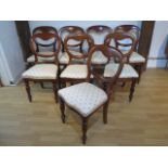 A matched set of eight (6 + 2) Victorian mahogany balloon back dining chairs with reupholstered