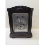 A Junghams oak chiming mantle clock with silver dial, 35cm tall, in working order, case good