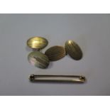 A pair of 9ct cufflinks and a 9ct bar brooch, total weight approx 4.5 grams