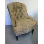 A Victorian button back upholstered fireside chair, 100cm tall x 69cm wide