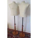 A pair of calico covered tailors busts on turned bases, adjustable stems, labels for 'Proportion'