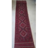 A hand knotted woollen Meshwani runner, 246cm x 62cm