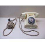 A cream bakelite 300 series vintage telephone with drawer, case and handset in good condition,