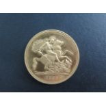 A Queen Elizabeth II gold £5 coin, dated 1997