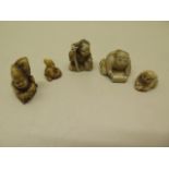 Five Japanese Meiji seated man carved ivory netsukes, tallest 3cm, some age related cracks otherwise