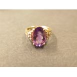 A 9ct yellow gold amethyst and diamond ring, size P 1/2, hallmarked, amethyst approx 14mm x 10mm