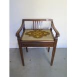 A nice Edwardian inlaid mahogany piano stool with lift up seat, 66cm tall x 48cm wide