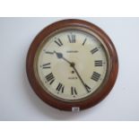 An 8 day oak cased 12" dial wall clock in running order