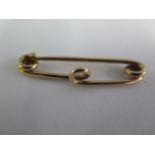 A gold pin approx 3.8 grams, tests to approx 9ct