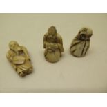 Three Japanese Meiji carved ivory netsukes, tallest 3.5cm, age related crack to one otherwise good