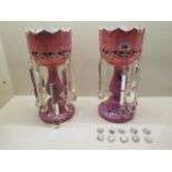 A pair of Victorian decorated pink glass lustres, 36cm tall, 10 small drops have damage some drops