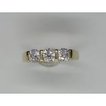A 14ct yellow gold three stone diamond ring, size M, each diamond approximately 0.33ct, in good