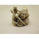 A 19th century Japanese Meiji carved netsuke - old man and children, signed, 4cm x 4cm, in good