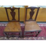 A pair of Georgian oak side chairs in polished condition, 90cm tall