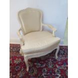 A French style painted open armchair upholstered in Dupion silk, 94cm tall x 68cm wide, generally