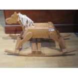 A vintage pine rocking horse, 58cm tall x 96cm long
