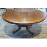 A good Victorian burr walnut tilt top oval breakfast table on a quatrefoil column and splayed leg
