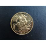 A Queen Elizabeth II gold £2 coin, dated 1987