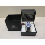 A Swan and Edgar vintage numeral automatic wristwatch boxed with card in unworn condition in working