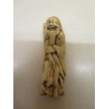 A 19th century Japanese Meiji carved ivory netsuke of a bearded man, 6.5cm tall, in good condition