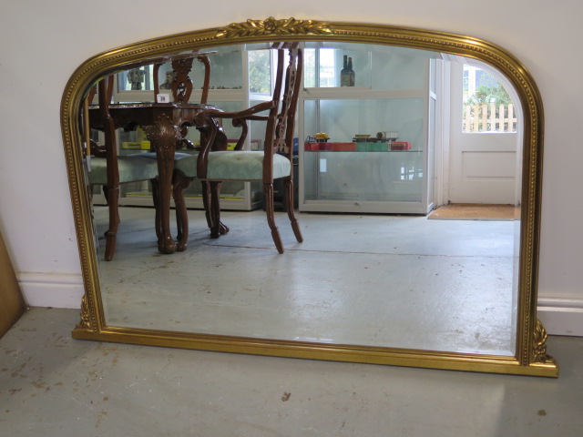 A modern gilt bevel edge overmantle mirror, 92cm x 140cm