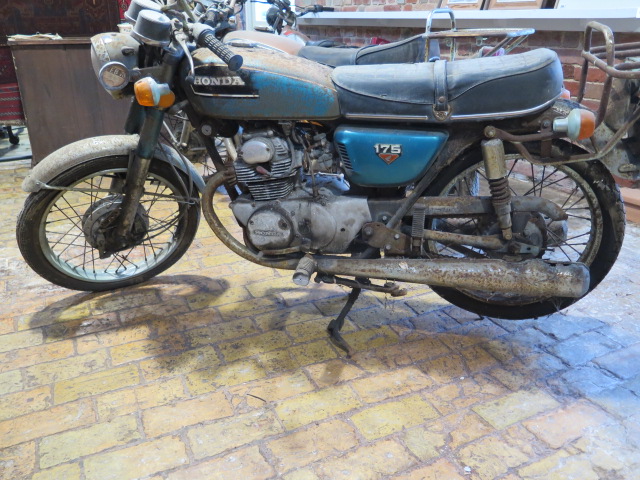 A Honda 175cc 1973 vintage motorcycle, reg PKL 22M, in need of restoration with vehicle registration