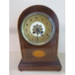 A Japy Freres Edwardian mantle clock with a medallion dial striking on a gong with key, running,