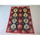 A hand knotted woollen Shiraz Gabbeh rug, 1.50m x 1.05m