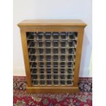 An oak 48 bottle wine rack made by a local craftsman to a high standard, 98cm tall x 74cm x 28cm